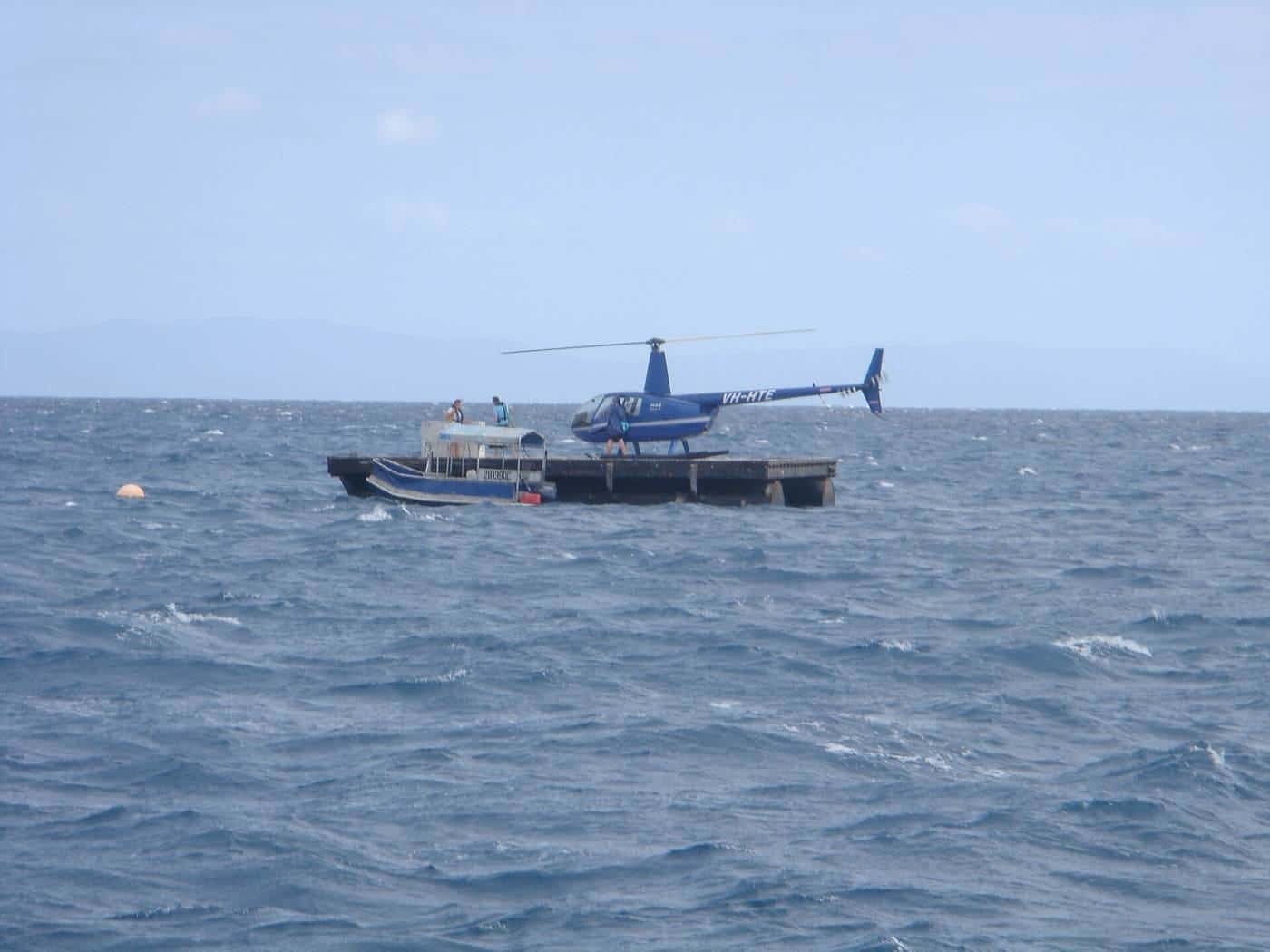 A helicopter landing on a reef pontoon