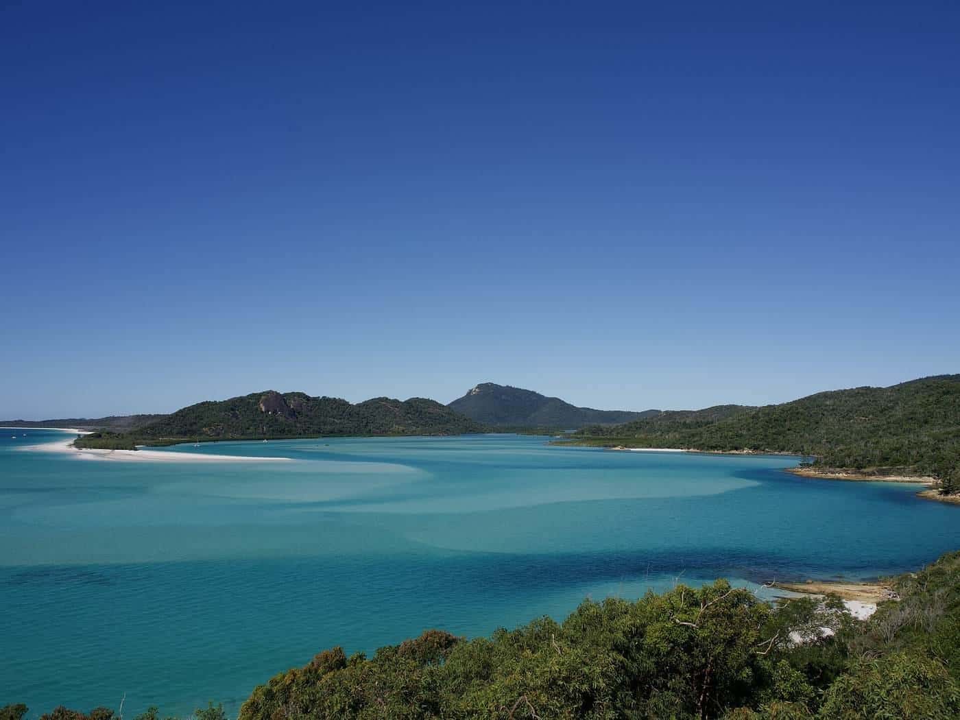 Swirling white sand and turquoise water at Hill Inlet