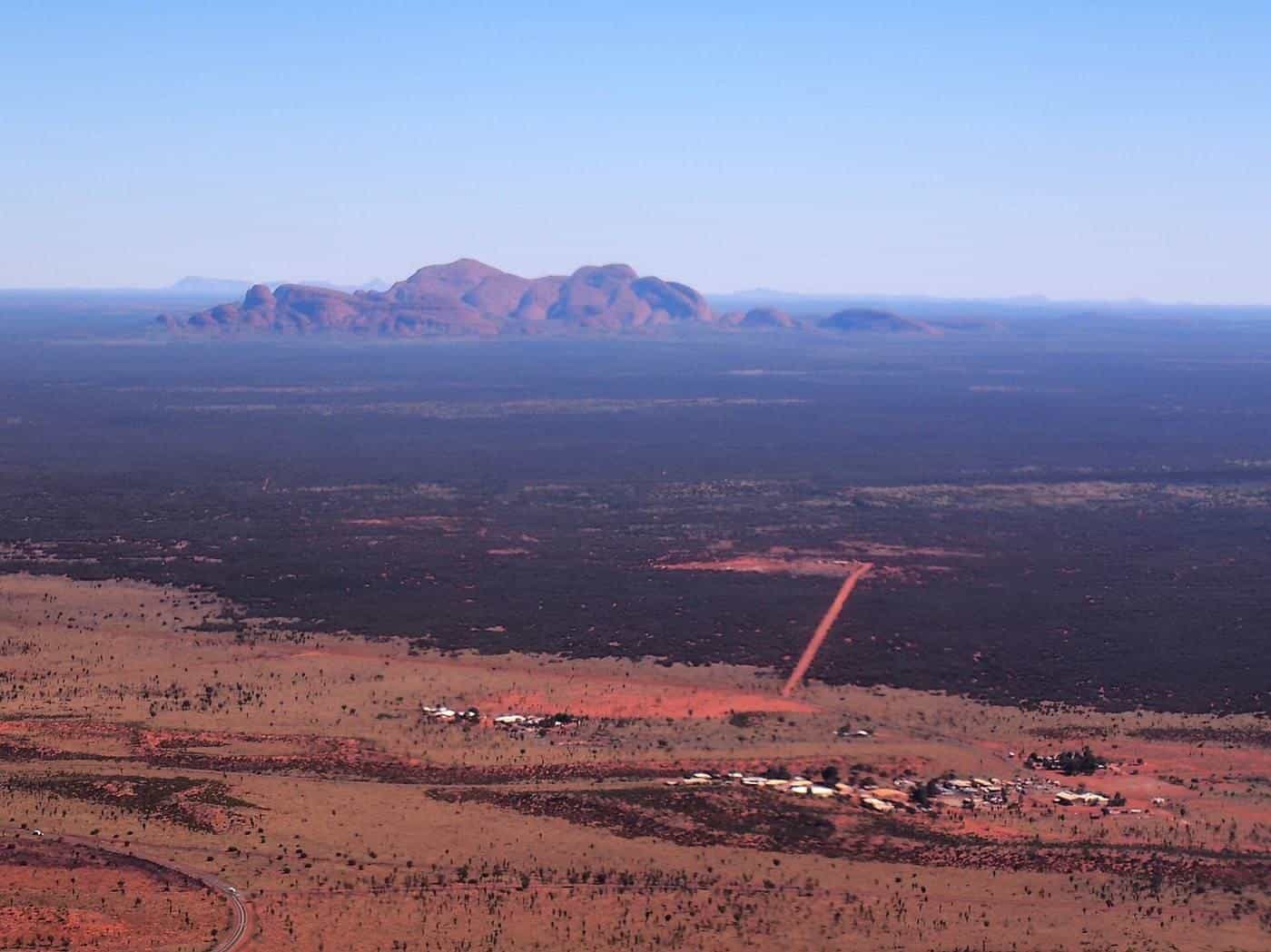 Kata Tjuta on the horizon across red desert country