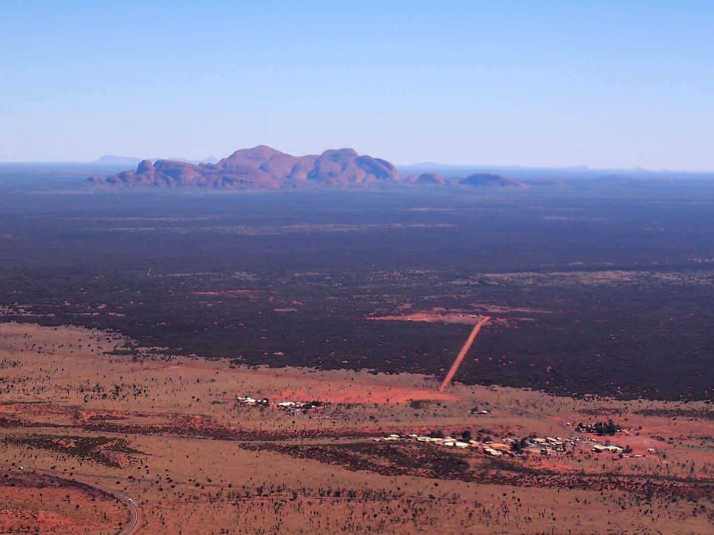 Kata Tjuta on the horizon across red desert country